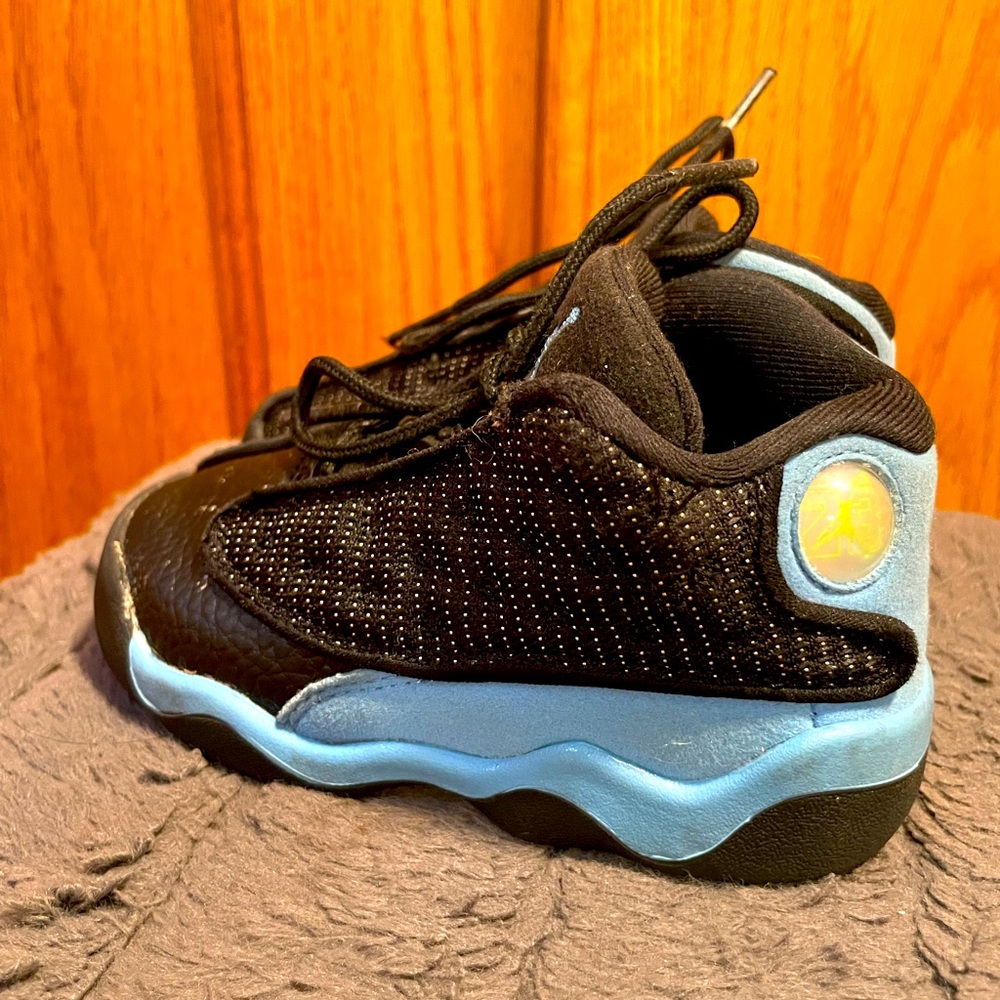 Child’s Jordan air retro 13 blue and black size 7 toddler